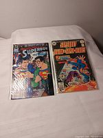 Front view of both Superboy comic books