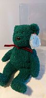 Full view of green Ty Holiday Teddy bear seated