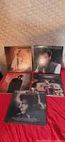All five Rick Springfield albums laid out on red surface
