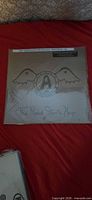Front of sealed LP jacket showing Aerosmith logo, album title and hype strip