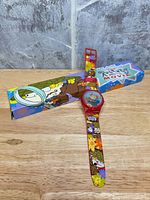 Watch front with strap and printed box