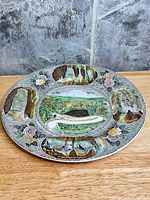 Front view showing entire decorative plate with multiview Carlsbad Caverns design