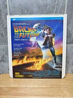 Front view of Back to the Future MCA CED videodisc cardboard caddy