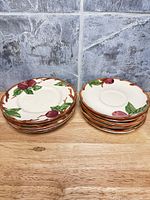 Stacked saucers showing top decoration and quantity