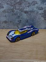 Front three-quarter view showing graphics, canopy and wheel style