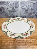 Top view showing full platter, floral sprays and turquoise gold border