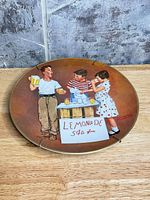 Front of plate showing full Norman Rockwell image and gold rim