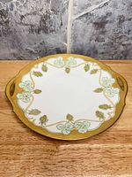 Top view showing full design, gold border, handles