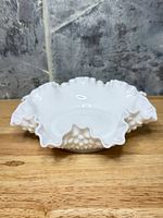 Top-angled view showing ruffled rim and hobnail sides