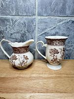 Creamer and footed mug front view