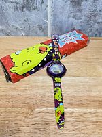 Watch laid flat with Rugrats Movie box sleeve