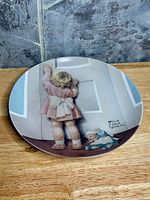 Front view of Victoriana Fine China plate showing illustration and condition