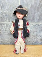 Front view showing full costume, embroidery, tassels and overall condition