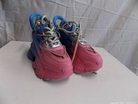 Front angle showing both sneakers, color gradient and platform soles