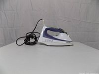Side profile of Black & Decker steam iron with cord coiled