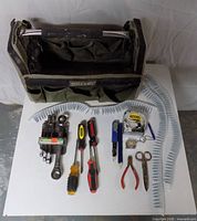 Overall lot view showing Woodcraft bag and all tools laid out