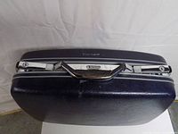 Top view showing Samsonite logo, handle, latches and trim