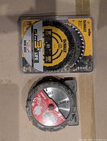 Sealed DeWalt 10-inch blade pack and Mibro dado set case