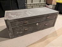 Exterior of brown Kennedy machinist chest showing wear and two drawers