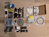 Overview of all bicycle parts laid out on cardboard
