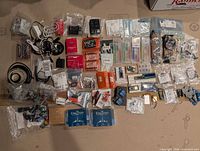 Overview of entire lot laid out, showing boards, breadboards, cables and components