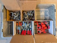 Overall view of divided tote showing C-clamps, toggle clamps and pipe clamp heads