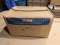 Sealed Uline box labeled Flat Merchandise Bags