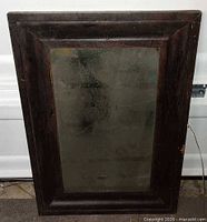 Front view of full mirror showing frame and glass condition