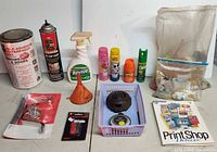All items laid out showing variety of hardware, sprays, tool, software and basket