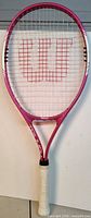 Front view of pink and white Wilson Triumph tennis racket