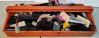 Toolbox filled with assorted RC parts