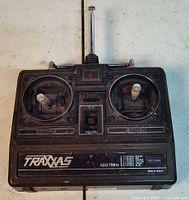 Front view showing Traxxas AM27MHz transmitter with joysticks and antenna