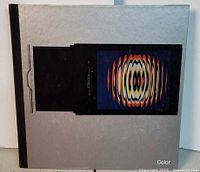 Front cover showing title image and silver board