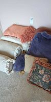 Group showing throws, bolster pillows, tapestry pillows and faux-fur backrest pillow