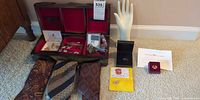 Full lot overview showing valet box open, ties, metal accessories, razor, display hand and presentation boxes