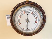Full front view of barometer on wall