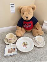 Group shot showing Harrods bear, fluted bowl, square dish, two teacups and saucers