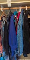 Multiple jackets and coats on closet rod
