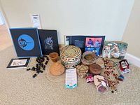 Group shot of all baskets, necklaces, prints, textiles and note