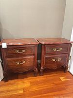 Front view of both nightstands showing overall design, finish and drawer configuration