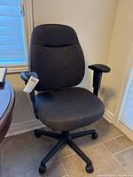 Full view of patterned swivel office chair