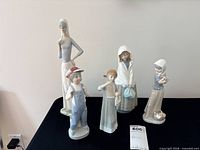 Group view of all five porcelain figurines