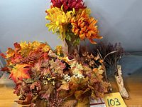 Group shot of all artificial fall floral items on table