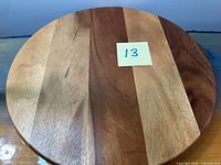 Top view showing striped acacia wood surface and overall condition