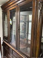 Full view upper glass door section and crown molding