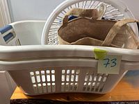 Large rectangular basket with round basket and jute bag inside