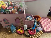 overview of bins, bag of mini boxes, loose toys on floor