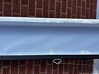 close view of screen material, white frame and black trim