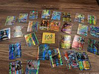 Overhead view showing entire spread of holographic Pokémon cards
