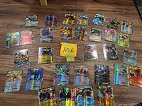 All 29 holographic Pokémon cards laid out on floor